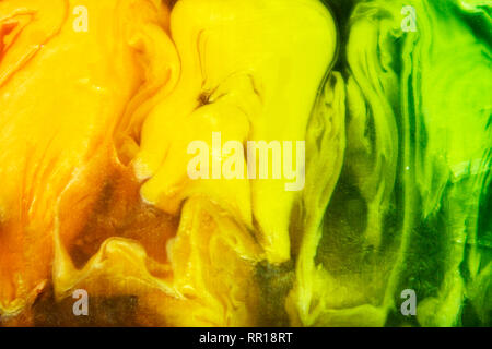 Сolorful piece of handmade semitransparent soap closeup, scenic yellow and green frozen forms Stock Photo