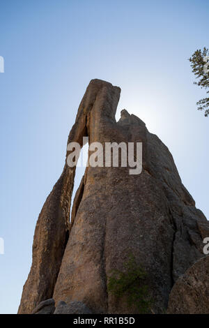 The large unique formation of Needle Eye rock in the Needles section of Custer State Park, South Dakota. Stock Photo