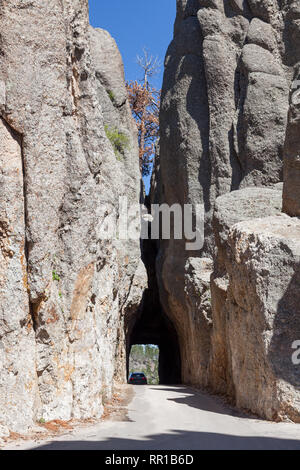 Needles Eye Tunnel carved through solid rock on a spring day in Custer State Park, South Dakota. Stock Photo