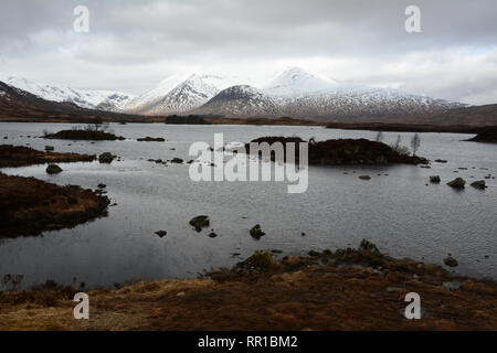 The snow dusted Black Mount range and Lochan na h-Achlaise in Rannoch Moor, in the western Scottish Highlands, Scotland, United Kingdom. Stock Photo