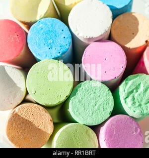 Pack of Jumbo Sidewalk Chalk, Assorted Colors on White Background. Top View Stock Photo