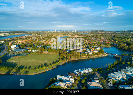 Aerial view of Varsity Lakes suburb and Reedy Creek at sunset. Gold Coast, Queensland, Australia Stock Photo