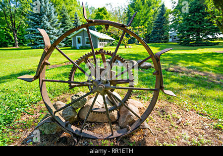 Antique Wheel & Gears On The Farm Stock Photo