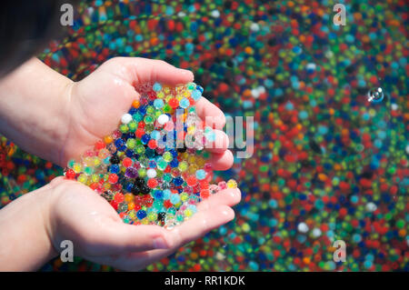 Water beads held in a hand Stock Photo