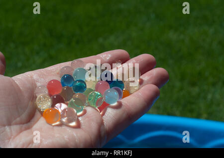 Water beads held in a hand Stock Photo