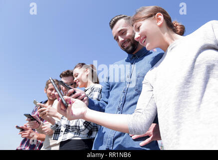 group of young people with modern gadgets Stock Photo