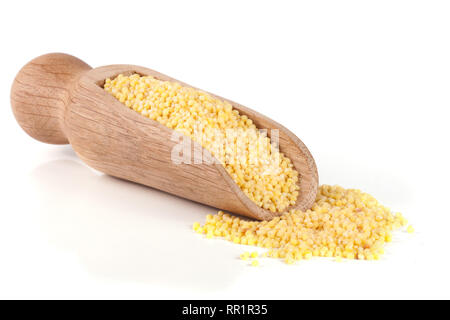 Millet in a wooden shovel isolated on white background Stock Photo