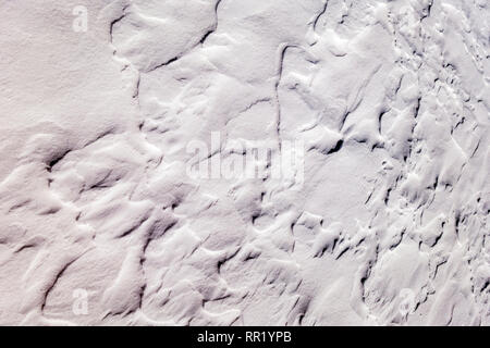 Close up of wind sculpted patterns in fresh snow Stock Photo
