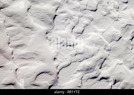 Close up of wind sculpted patterns in fresh snow Stock Photo
