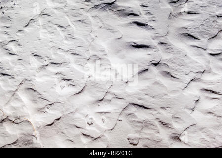 Close up of wind sculpted patterns in fresh snow Stock Photo