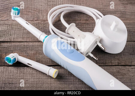 Electric Toothbrush on an old wooden background Stock Photo