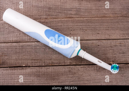 Electric Toothbrush on an old wooden background Stock Photo