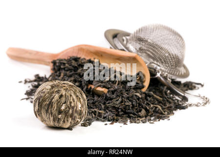 tea strainer with a wooden shovel isolated on white background Stock Photo