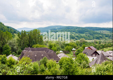 View over the village of Barsana, famous for its wooden church, in in the Maramure? region in Romania. Stock Photo