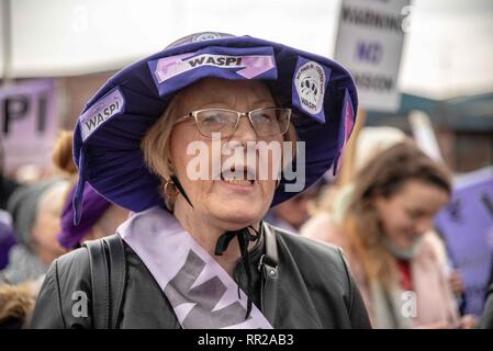 Govan, Glasgow City, UK. 23rd Feb, 2019. A protester is seen shouting slogans during the demonstration.Protesters from all over Scotland took part in a protest against the changes in the state pension for women. WASPI (Women Against State Pension Injustice) and several other groups took to the streets in protest over it. Credit: Stewart Kirby/SOPA Images/ZUMA Wire/Alamy Live News Stock Photo