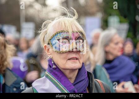 Govan, Glasgow City, UK. 23rd Feb, 2019. A masked protester seen during the demonstration.Protesters from all over Scotland took part in a protest against the changes in the state pension for women. WASPI (Women Against State Pension Injustice) and several other groups took to the streets in protest over it. Credit: Stewart Kirby/SOPA Images/ZUMA Wire/Alamy Live News Stock Photo