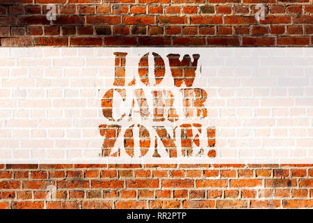 Handwriting text writing Low Carb Zone. Concept meaning Healthy diet for losing weight eating more proteins sugar free Brick Wall art like Graffiti mo Stock Photo