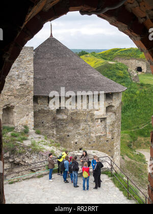 A group of tourists in Kamianets-Podilskyi Castle, Ukraine. Stock Photo