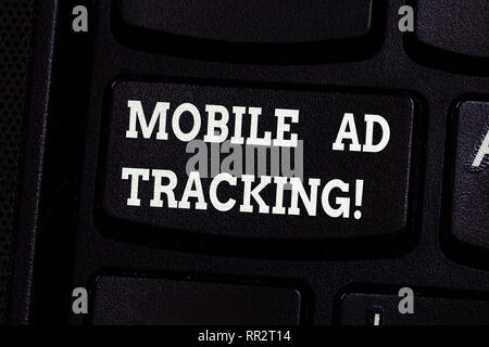 Handwriting text writing Mobile Ad Tracking. Concept meaning monitor brand perforanalysisce including advertising awareness Keyboard key Intention to  Stock Photo