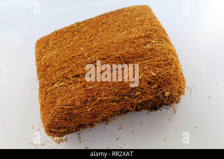 A slice of pressed tobacco that grows in Indonesia. A closeup view. Stock Photo
