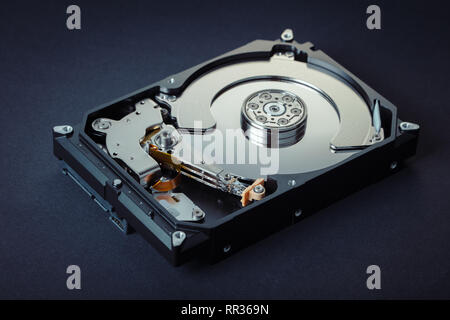 disassembled computer hard drive on black background Stock Photo