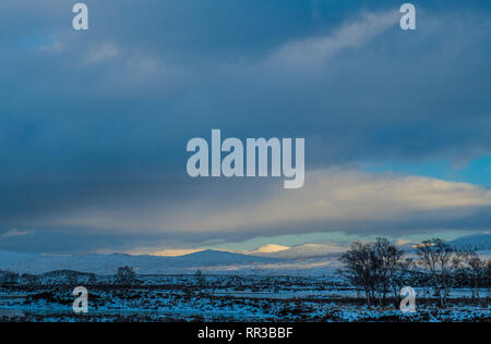 Looking Across Rannoch Moor on a cold winter day with snow on the ground, Scottish Highlands Stock Photo