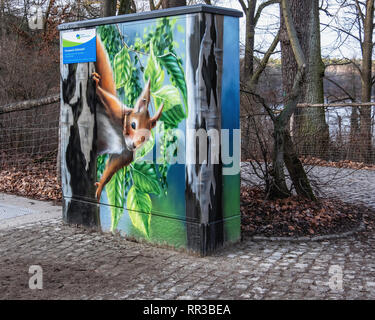 Berlin- Zehlendorf. Krumme Lanke. Decorative paitwork on Utility Box - red squirrel  in tree painting Stock Photo
