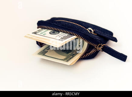 Black suede leather wallet isolated on white background with dollars Stock Photo