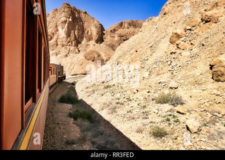 The Lezard Rouge (Red Lizard) is a nostalgic train that runs between Redeyef and Métlaoui. The photo shows it in the Selja gorge. Stock Photo