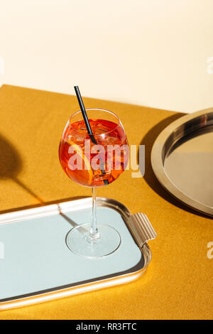 Spritz veneziano, an IBA cocktail with Prosecco or white sparkling wine, bitter, soda, ice and a slice of orange, in a calix on a table Stock Photo