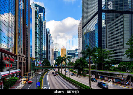 Hong Kong - August 9, 2018: Morning traffic in Hong Kong downtown area with modern buildings surrounding Stock Photo