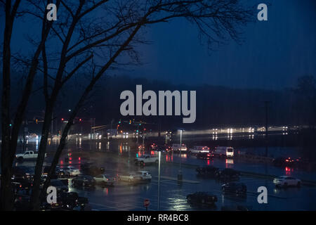 Tinton Falls, United States - November 13 2018:   Traffic at the junction of Hope Road and NJ-36 at night in the pouring rain Stock Photo