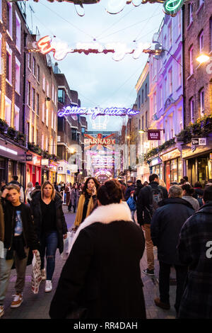 London, United Kingdom - December 29 2018:   Shoppers crowd along Carnaby Street shops at Christmas Stock Photo