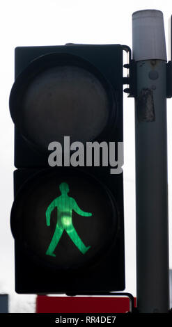 Reading, United Kingdom - February 09 2019:   Pelican crossing sign showing green man for safe to cross on Caversham Road Stock Photo