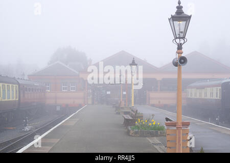 Kidderminster, UK. 24th February, 2019. UK weather: despite thick morning fog across Worcestershire, nothing dampens the spirit of the dedicated volunteers at Severn Valley Railway - the misty morning providing an atmospheric, picturesque start to the day. Credit: Lee Hudson/Alamy Live News Stock Photo