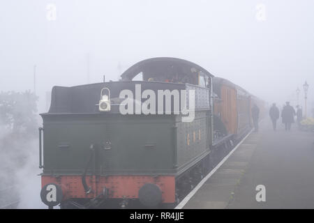 Kidderminster, UK. 24th February, 2019. UK weather: despite the thick morning fog across Worcestershire, nothing dampens the spirit of the dedicated volunteers at Severn Valley Railway and the misty morning provides an atmospheric and picturesque start to the day. Credit: Lee Hudson/Alamy Live News Stock Photo