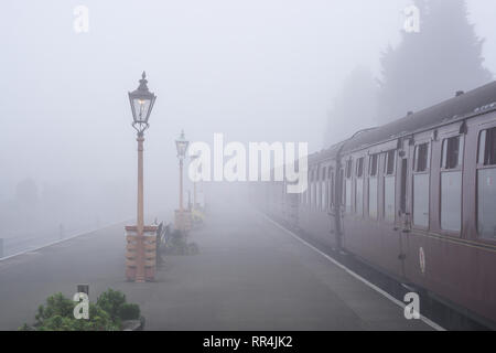 Kidderminster, UK. 24th February, 2019. UK weather: despite the thick morning fog across Worcestershire, nothing dampens the spirit of the dedicated volunteers at Severn Valley Railway; the misty morning providing an atmospheric and picturesque start to the day for any passengers boarding these vintage trains. Credit: Lee Hudson/Alamy Live News