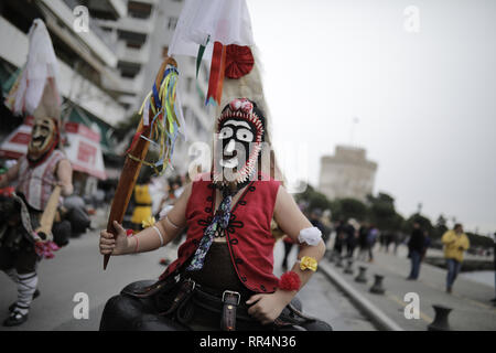 Thessaloniki, Greece. 24th Feb, 2019. Participants wearing traditional costumes dance as they march at the seafront of Thessaloniki. The Folklife and Ethnological Museum of Macedonia organized the fifth European assembly of bell bearers in Thessaloniki. The assembly took place in the context of the action ''Bell Roads'', which attempts to explore the customs of bell bearing in Europe. he Credit: ZUMA Press, Inc./Alamy Live News Stock Photo