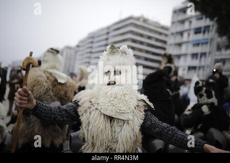 Thessaloniki, Greece. 24th Feb, 2019. Participants wearing traditional costumes dance as they march at the seafront of Thessaloniki. The Folklife and Ethnological Museum of Macedonia organized the fifth European assembly of bell bearers in Thessaloniki. The assembly took place in the context of the action ''Bell Roads'', which attempts to explore the customs of bell bearing in Europe. he Credit: ZUMA Press, Inc./Alamy Live News Stock Photo