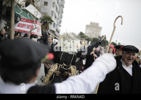 Thessaloniki, Greece. 24th Feb, 2019. Participants wearing traditional costumes dance as they march at the seafront of Thessaloniki. The Folklife and Ethnological Museum of Macedonia organized the fifth European assembly of bell bearers in Thessaloniki. The assembly took place in the context of the action ''Bell Roads'', which attempts to explore the customs of bell bearing in Europe. he Credit: ZUMA Press, Inc./Alamy Live News Stock Photo