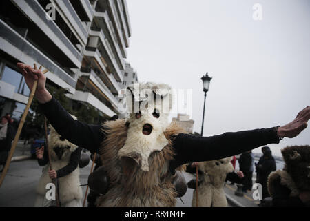 Thessaloniki, Greece. 24th Feb, 2019. Participants wearing traditional costumes dance as they march at the seafront of Thessaloniki. The Folklife and Ethnological Museum of Macedonia organized the fifth European assembly of bell bearers in Thessaloniki. The assembly took place in the context of the action ''Bell Roads'', which attempts to explore the customs of bell bearing in Europe. he Credit: ZUMA Press, Inc./Alamy Live News Stock Photo