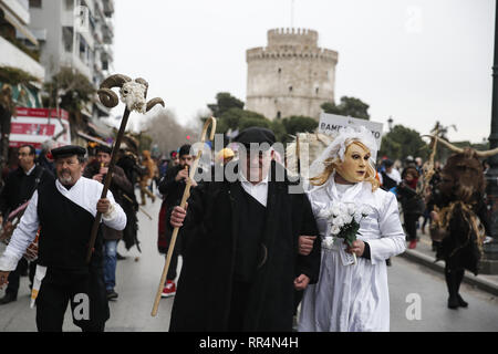 Thessaloniki, Greece. 24th Feb, 2019. Participants wearing traditional costumes dance as they march at the seafront of Thessaloniki. The Folklife and Ethnological Museum of Macedonia organized the fifth European assembly of bell bearers in Thessaloniki. The assembly took place in the context of the action ''Bell Roads'', which attempts to explore the customs of bell bearing in Europe. he Credit: ZUMA Press, Inc./Alamy Live News Stock Photo