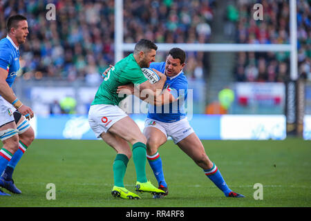 Rome, Italy. 24th of February, 2019. Ireland's full back Rob Kearney tries to keep the ball away from Italian defense in Guinness Six Nations Credit: Massimiliano Carnabuci/Alamy Live News Stock Photo