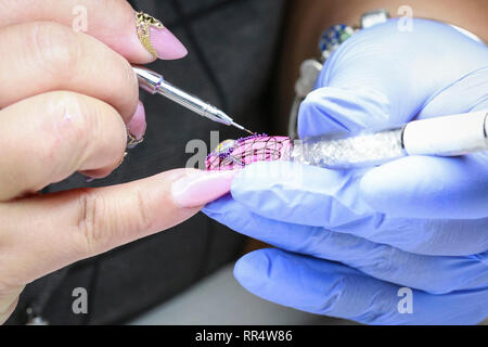 ExCel London, London, UK , 24th Feb 2019. Intricate nail design. The Professional Beauty show brings together hair and beauty practitioners, cosmetics and aesthetics professionals,  and representatives of over 800 brands with those interested in hair and beauty in the UK's biggest industry event at ExCel London Exhibition Centre on Fb 24 and 25. Credit: Imageplotter/Alamy Live News Stock Photo