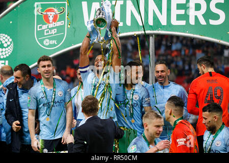 London, UK. 24th Feb, 2019. Vincent Kompany of Manchester City lifts the trophy during the EFL Carabao Cup Final between Chelsea and Manchester City at Wembley Stadium, London, England on 24 February 2019. Photo by Carlton Myrie. Editorial use only, license required for commercial use. No use in betting, games or a single club/league/player publications. Credit: UK Sports Pics Ltd/Alamy Live News Stock Photo