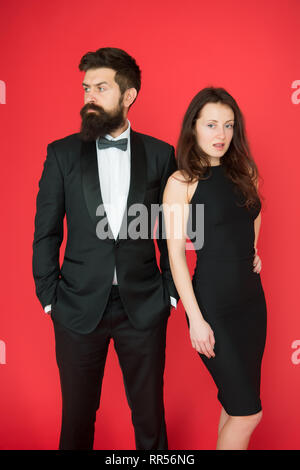 Portrait of positive couple prepare for family meeting dress code girl fix  boyfriend bow-tie wear red dress deotted shirt suspenders pants isolated  over bright shine color background Stock Photo | Adobe Stock