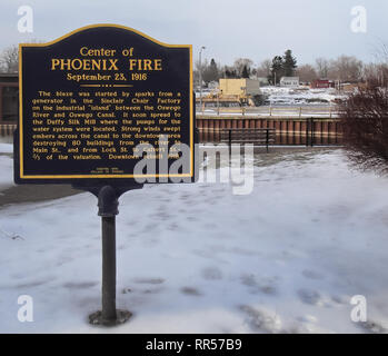 Phoenix, New York, USA. February 23, 2019. Memorial plaque in the small town center of Phoenix, New York, on the Oswego River, commemorating a disaste Stock Photo