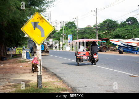 Thai people riding and driving on the road at Ban Phe village city on July 4, 2018 in Rayong, Thailand Stock Photo