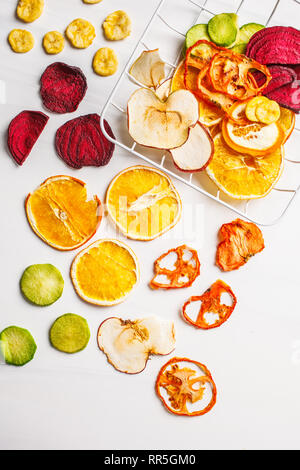 Dried vegetables and fruits on a white background. Plant based food concept. Stock Photo