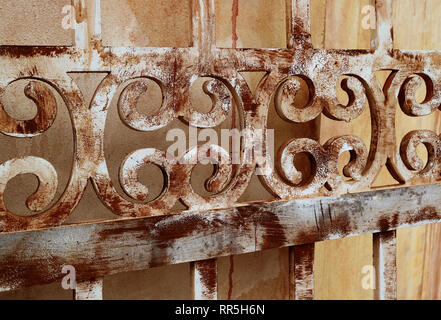 Diminishing perspective of gorgeous pattern of a color faded old wooden decorative fence Stock Photo